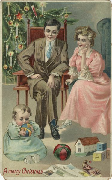 Holiday postcard with a father and mother seated in chairs watching their baby play with a ball. A decorated Christmas tree is in the background. Other toys are on the floor at their feet. The mother wears a pink dress with white lace, white stockings and shoes. The father wears a brown suit, white shirt, blue socks and tie, and black shoes. The baby wears a light green dress and white booties. The text: "A Merry Christmas" is in the lower left corner. Chromolithograph. The image is embossed.