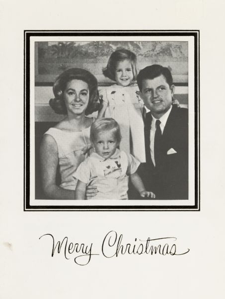 Holiday card from Senator Ted Kennedy and Mrs. Joan Kennedy. Front of card reads: "Merry Christmas" and has a cutout with a gold foil border which shows the image of the Kennedy family. The inside of the card reads: "With Best Wishes for the New Year, Joan and Ted Kennedy." Offset lithography, foil stamped and die cut.