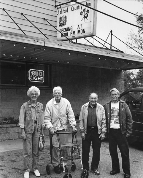 Members of the fish fry group outside restaurant. From left to right; Shirley Widmer, Ralph Widmer, Rudy Heinecke, and Ralph "Buddy" Ruecker.
 
