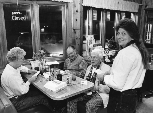 "Ruth Emery waits on us at the Marshland Cafe. Perch dinners for senior citizens are $7.15." From left to right; Shirley Widmer, Rudy Heinecke, Ralph Widmer, and Ruth Emery.