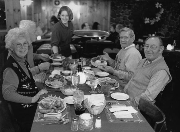 "Dawn Stott is our waitress at Walden Supper Club, Perch are $8.95." From left to right; Shirley Widmer, Ralph Widmer, Dawn Stott, Ralph "Buddy" Ruecker, and Rudy Heinecke.
