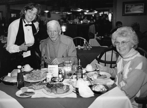 "Stacey is our waitress at Andersons on Friess Lake, (near Holy Hill). Perch are $9.95." From left to right; Stacey, Ralph Widmer, and Shirley Widmer.