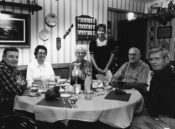 "Karen Catania is our waitress at the Country Retreat, 3461 High Road, Hartford, WI." From left to right; Bob White, Jean White, Shirley Widmer, Karen Catania, John Bodden, and Ralph "Buddy" Ruecker.