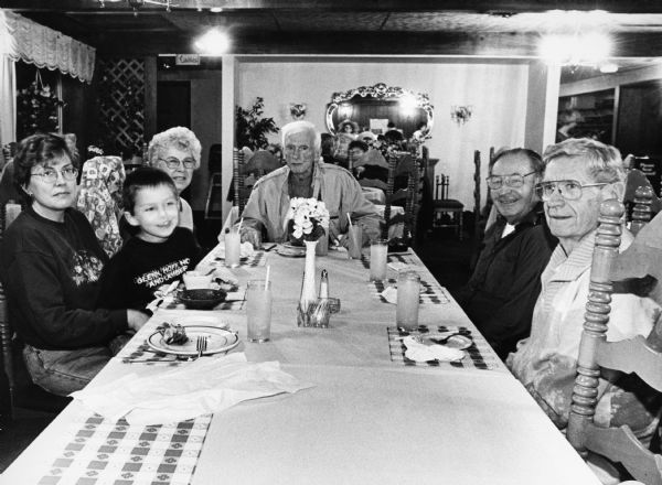"We celebrate Ralph's 83rd birthday at Frank's On The Lake". From left to right; Brenda Wilz, Logan, Shirley Widmer, Ralph Widmer, Rudy Heinecke, and Ralph "Buddy" Ruecker.