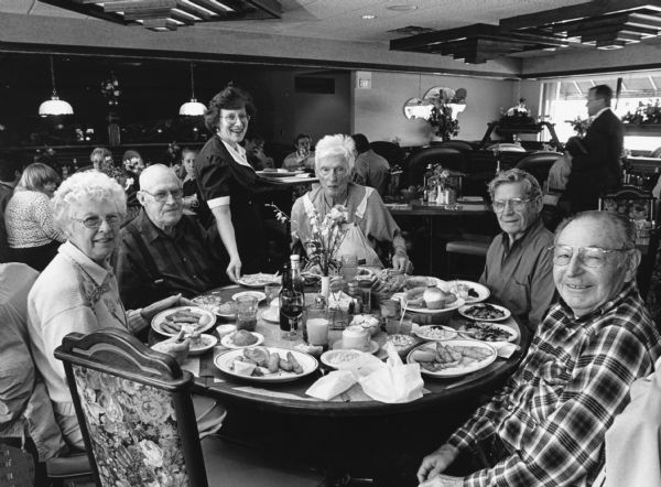 "Our waitress at Rolling Meadows Family Restaurant, Sharon McKee, informs us that she is planning an August 21st wedding." From left to right; Shirley Widmer, John Bodden, Sharon Mckee, Ralph Widmer, Ralph "Buddy" Ruecker, and Rudy Heinecke.