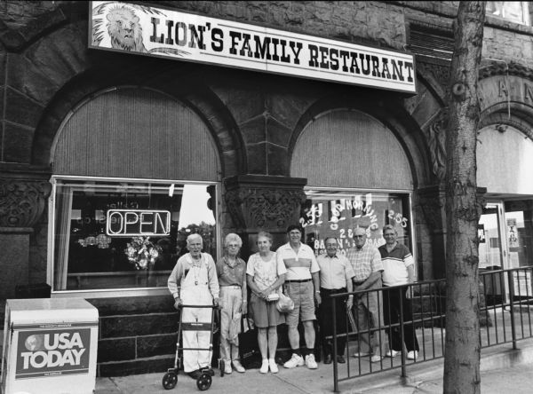 "Ruth and Orville Kern, join us at the Lion's Family Restaurant at the corner of 1st and Main Street in Fond du Lac, WI." From left to right; Ralph Widmer, Shirley Widmer, Ruth Kern, Orville Kern, Rudy Heinecke, John Bodden, and Ralph "Buddy" Ruecker.