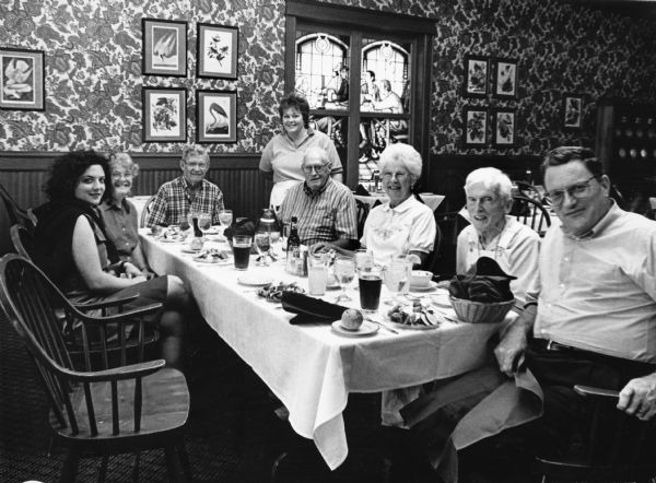"Laura, our waitress, poses with our group as we enjoy our dining experience at the Audubon Inn in Mayville."