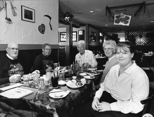 "Kris, is our waitress at Sal's on Main. Sal's on Main has been in business for three years." From left to right; John Bodden, Ralph "Buddy" Ruecker, Ralph Widmer, Shirley Widmer, and Kris.