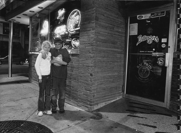 "This Friday we are at Dillinger's, 1 South Main St., Fond du Lac. Dillinger's is named after John Dillinger, a notorious thief who robbed banks throughout the Midwest in the 30's. Carly and Parker Hren posed in front of Dillinger's."