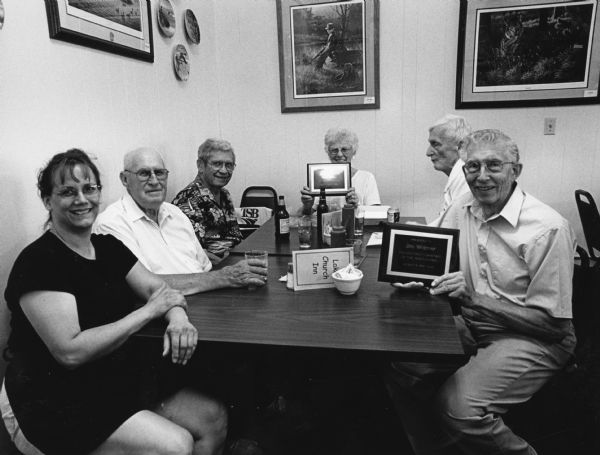 "Lynn was our waitress at Lake Church Inn. John & Buddy surprised Jim & Shirley with plaques stating: 'Fish Fry Photographer of the Years' & 'Fish Fry Driver of the Years.'" This is the first picture in the series where Jim Widmer is pictured.