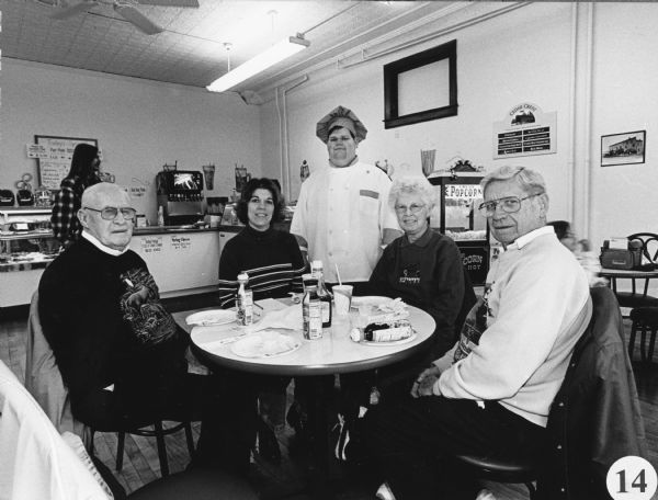 Proprietor Joel Bernhard joins the picture. This is the 200th fish fry that the group participated in. Andrea Hanson, second from the left, wrote an article about this special landmark in the "Mayville News" on March 27th, 2003.