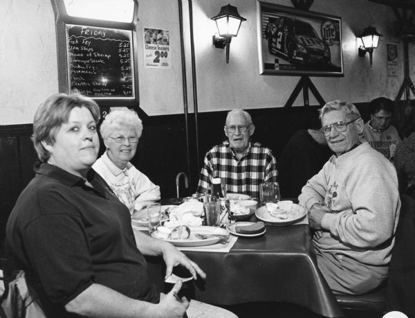 "Diane was our waitress when we visited The Wharf in Fox Lake." From left to right; Diane, Shirley Widmer, John Bodden, and Ralph "Buddy" Ruecker.