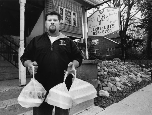 "Scoot Pastorius is shown with our Fish Fry's outside of J.O.'s, at 334 Main Street, Kewaskum. J.O.'s is primarily a take-out business."