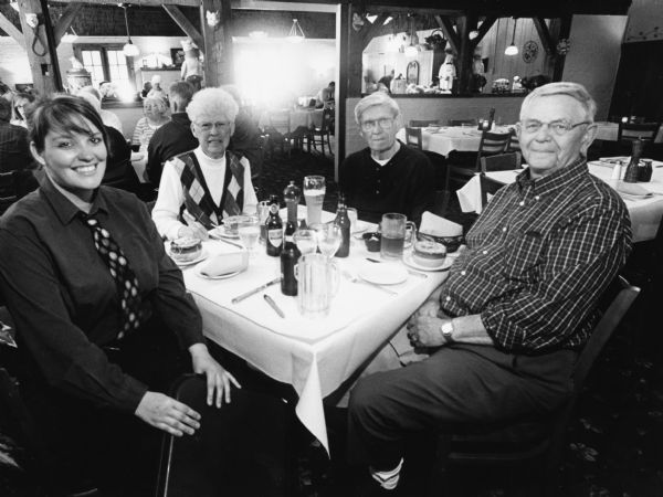"Kristin was our waitress at Jerry's Old Town Inn." From left to right: Kristin, Shirley Widmer, Ralph "Buddy" Ruecker, and Carl Bernhard.