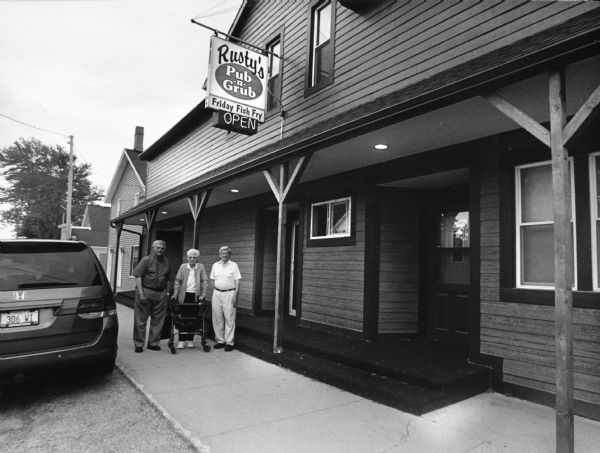 "Rusty's Pub-N-Grub at 1907 Highway 175, Richfield." From left to right; Carl Bernhard, Shirley Widmer, and Ralph "Buddy" Ruecker.
