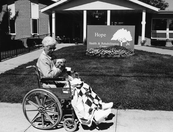 "(Note all eights) After having hip replacement surgery, Shirley Widmer is shown with her little friend Ginger, at Hope Health and Rehab, 475 Grove Street and Ashford Avenue, Lomira. Where Shirley received rehabilitation and therapy."