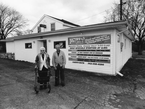 "This is doctor's Pub And Grill, W201 N10466 Appleton Avenue, Germantown." Shirley Widmer is on the left and Carl Bernhard is on the right.