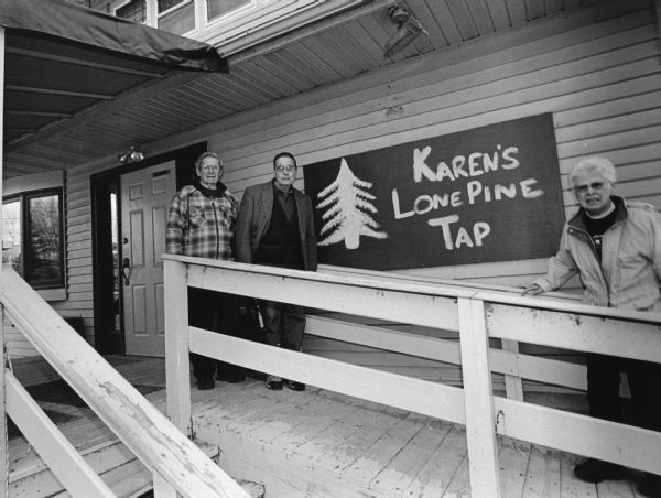 "Today we reach a new milestone with our 400th different restaurant. We are at Karen's Lone Pine Tap on Historical Lake Sinissippi. There address is N4571 Highway E, 1/2 mile North of Hustisford." From left to right; Ralph "Buddy" Ruecker, John P. Widmer, and Shirley Widmer.