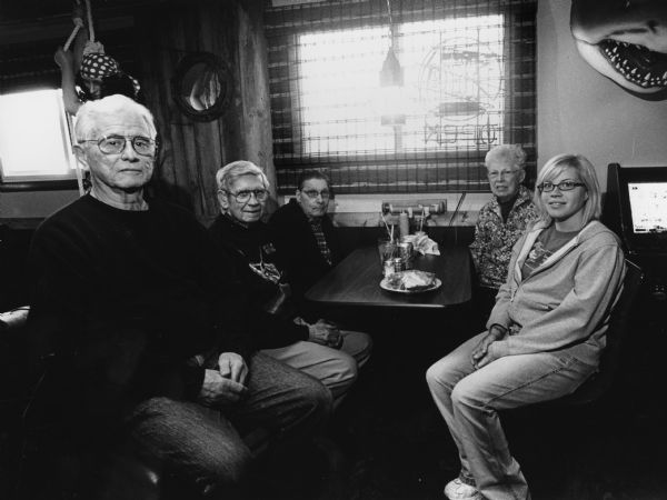 "Bridget was our waitress at Nan Sea's Tiki Bar and Grill, Dundee [Campbellsport]. From left to right, Jim Ruecker, Ralph "Buddy" Ruecker, John P. Widmer, Shirley Widmer, and Bridget.