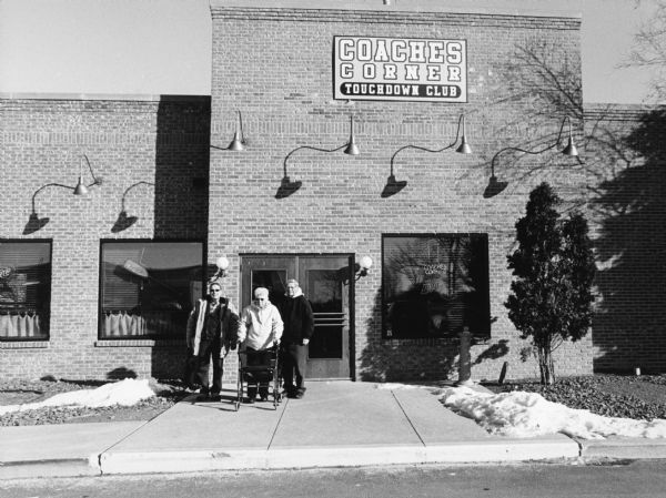 "Coaches Conder Touch Down Club, 121 N Pioneer Road, Fond du Lac. This was formerly Callahan's Grill and Bar and later Cactus Jacks. From left to right, John P. Widmer, Shirley Widmer, and Ralph "Buddy" Ruecker.


