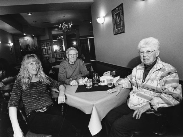 "Victoria, the owner, was our waitress at Victoria's Cornerstone Inn, Kewaskum." From left to right; Victoria, Ralph "Buddy" Ruecker, and Shirley Widmer.