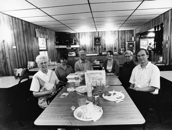 "At The Marsh Inn, we had as our guests, Andy Kraushaar, Visual Materials Curator at the Wisconsin Historical Society, and his wife [Deena Brazy]. Our waitress was Amber." From left to right; Shirley Widmer, Deena Brazy, Jim Ruecker, Amber, Ralph "Buddy" Ruecker, and  Andy Kraushaar.
