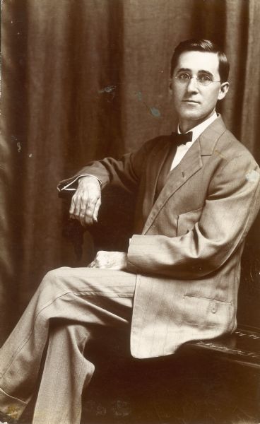 A seated portrait of William Elwell Middleton, wearing a suit.