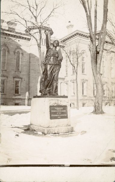 A winter view of the sculpture "Forward," created by Jean Pond Miner for the Wisconsin Women's Memorial at the 1893 World's Columbian Exhibition. It stands on the grounds of the third Wisconsin State Capitol.