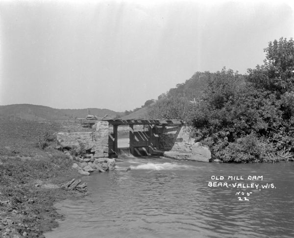 A dam constructed of cement and wood.