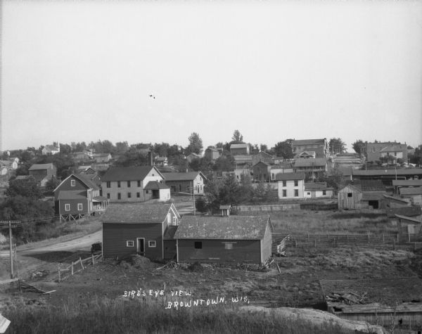 Elevated view of Browntown. In the foreground are farm buildings.