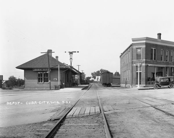 View down railroad tracks of the Cuba City train depot and post office.