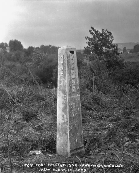 An iron post noting the state line separating Iowa and Minnesota. The post was erected in 1849.