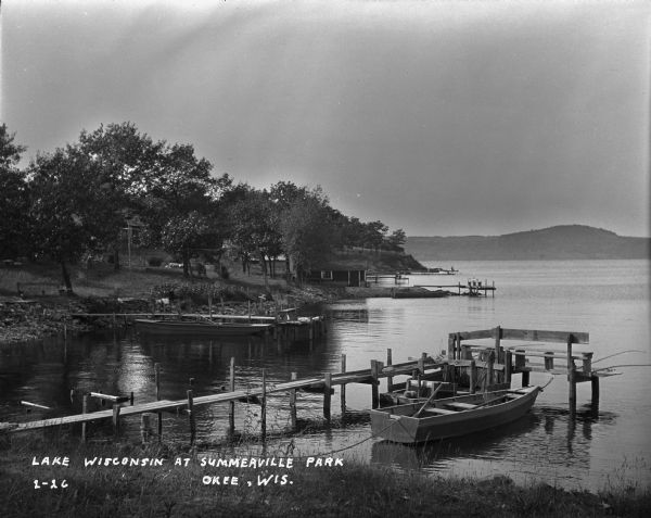 Lake Wisconsin at Summerville Park. Boathouses, docks and fishing boats are along the shoreline.