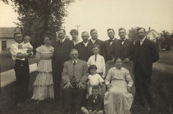 Outdoor group portrait of Conrad and Mary Schmitt's (Emma Gillett's parents) Golden Wedding Anniversary.