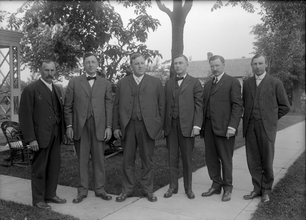 Outdoor group portrait of Sherwin Gillett's brothers-in-law. They are: Charles, Alfred, Louis, Gustav, Otto and Herbert.