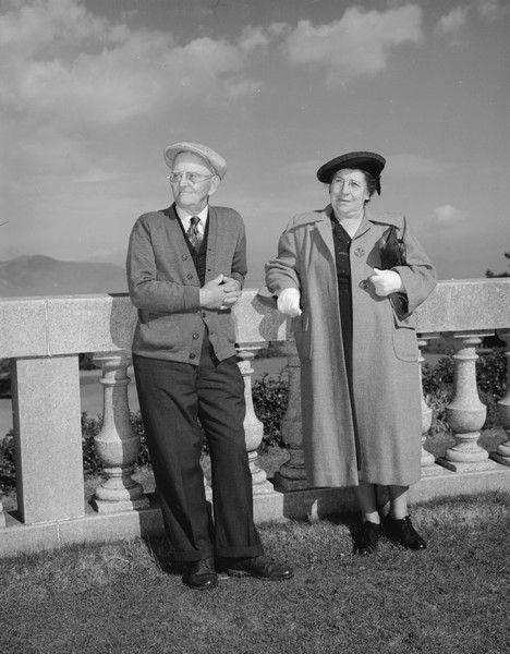 Outdoor portrait of Sherwin and Emma Gillett standing in front of the marble railing at the Legion of Honor.