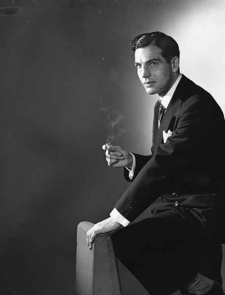 Indoor portrait of Lorin Gillette smoking a cigarette.
