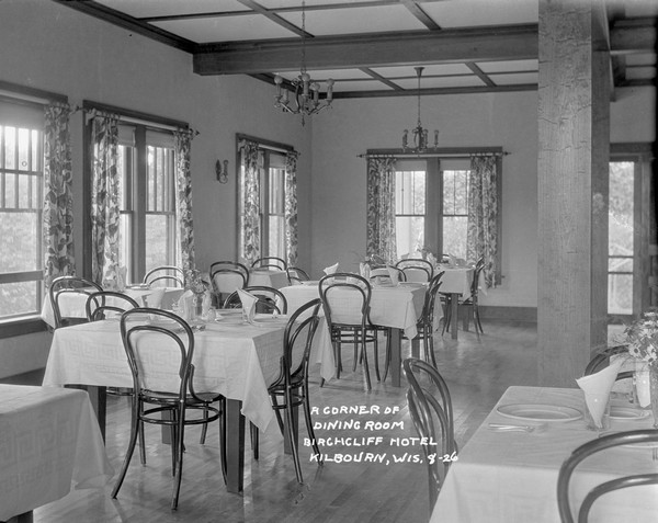 The dining room at the Birchcliff Hotel, with tables set for a midday meal.