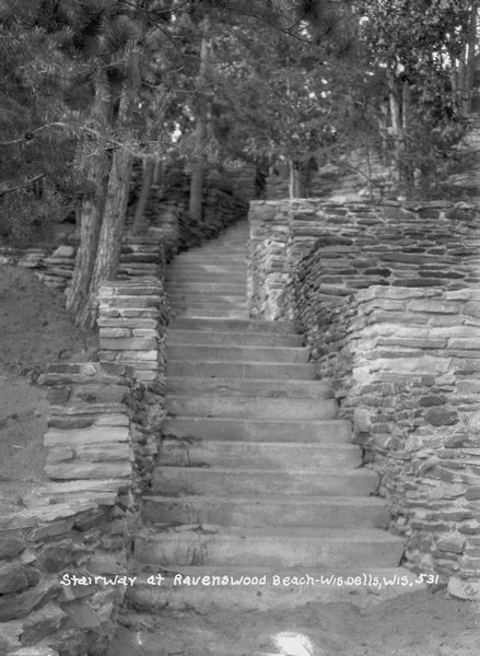 View up steep stone stairway with stone walls on the sides at the Ravenswood Hotel.