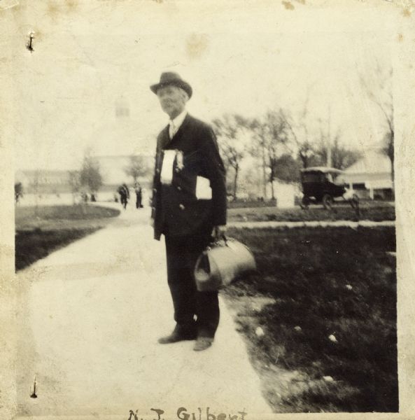 Full-length portrait of Nils J. Gilbert, a first lieutenant in Company A, 15th Wisconsin Infantry. The following information was obtained from the Regimental and Descriptive Rolls, Volume 20: He held residence in Manitowoc County, Wisconsin. On October 12, 1861 he enlisted as a first sergeant and was mustered into service in Madison, Wisconsin on December 12, 1861 with Company F, 15th Wisconsin Infantry at the age of 19. In December 1862 he was severely wounded at Stone River, Tennessee and was sent to a hospital in Nashville, Tennessee to recover.  On October 8, 1864, Nils J. Gilbert was transferred to Company A, 15th Wisconsin Infantry and was commissioned as first lieutenant. He was mustered out of service on December 12, 1864 with honors in Chattanooga, Tennessee.