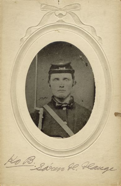 Head and shoulders oval studio portrait of Soren H. Hauge, a Wagoner in Company B, 15th Wisconsin Infantry, in uniform holding musket with fixed bayonet against shoulder. The following information was obtained from the Regimental and Descriptive Rolls, Volume 20: He held residence in Sterling, Wisconsin. On December 14, 1861, he enlisted and was mustered into service in Madison, Wisconsin on December 14, 1861, at the age of 22. He mustered out of service with Company B on December 20, 1864, at Chattanooga, Tennessee.