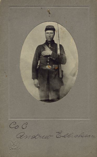 Three-quarter length oval studio portrait of Andrew Ellickson, a private of Company B, 15th Wisconsin Infantry, in uniform with bayonet sheathed on his side and holding his musket against his shoulder. The following information was obtained from the Regimental and Descriptive Rolls, Volume 20: He resided in Pleasant Springs, Wisconsin. On March 14, 1862, he enlisted and mustered into service at Madison, Wisconsin on December 02, 1861, at the age of 22. He was captured during the Battle of Chickamauga on September 19, 1863, and returned to Company B on November 19, 1863, as a paroled prisoner of war. On January 1, 1865, he was transferred to Company H and temporary attached to the 24th Wisconsin Infantry. Ellickson was then transferred to Company I, 13th Wisconsin Infantry on June 10, 1865, at Nashville, Tennessee as a paroled prisoner.