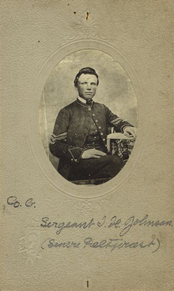 Waist-up seated oval studio portrait of John Henry Johnson, a sergeant in Company G, 15th Wisconsin Infantry, in uniform. The following information was obtained from the Regimental and Descriptive Rolls, Volume 20: He resided in Primrose, Wisconsin. On November 11, 1861, he enlisted in Primrose, Wisconsin and was mustered into service in Madison, Wisconsin on December 13, 1861, at the age of 24. He was appointed as a sergeant on January 1, 1862, and he received commission as a chaplain on October 19, 1864, from Governor James T. Lewis of Wisconsin for Companies F and G, 15th Wisconsin Infantry. He was mustered out of service on January 13, 1865 at Chattanooga, Tennessee.