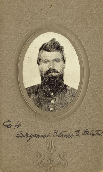 Head and shoulders oval studio portrait of Stener E. Bilstad, a first sergeant in Company H, 15th Wisconsin Infantry, in uniform. The following information was obtained from the Regimental and Descriptive Rolls, Volume 20: He resided in Christiana, Wisconsin and on October 21, 1861, he enlisted in Christiana, Wisconsin. He was mustered into service on February 13, 1862, in Madison, Wisconsin at the age of 33. On January 16, 1862, he was appointed to the rank of first sergeant. On February 13, 1865, he mustered out of service with Company H in Chattanooga, Tennessee.