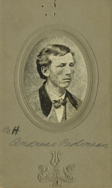 Head and shoulders oval studio portrait of Andreas Pederson [as written on the photograph backing; also written as Anders Pederson on Descriptive Rolls, Volume 20 (“Blue Book”) and published rosters: Roster of Wisconsin Volunteers, Volume 1 (1886) and Wisconsin Volunteers (1914) ; and written as Andrew Pederson on Descriptive Rolls Volume 20 (“Red Book”)], a private in Company H, 15th Wisconsin Infantry. On February 12, 1865, he was temporarily detached to the 24th Wisconsin Infantry. Then on June 10, 1865, he was transferred to Company I, 13th Wisconsin Infantry.  He was mustered out of service as a member of Company H, 15th Wisconsin Infantry on July 29, 1865 at Prairie du Chien, Wisconsin due to orders from the War Department dated April 29, 1865.