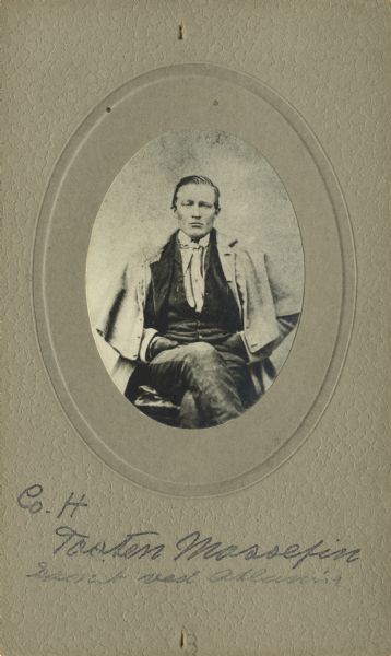 Seated oval studio portrait of Tosten Mossefin, a private in Company H, 15th Wisconsin Infantry. The following information was obtained from the Regimental Description Rolls, Volume 20: On October 19, 1861 he enlisted in Cambridge, Wisconsin and then was mustered into service in Madison, Wisconsin on February 13, 1862, at the age of 22. He was wounded slightly in the head near Atlanta, Georgia on August 17, 1864, and was sent to a division hospital. He mustered out of service with Company H on February 13, 1865, at Chattanooga, Tennessee.