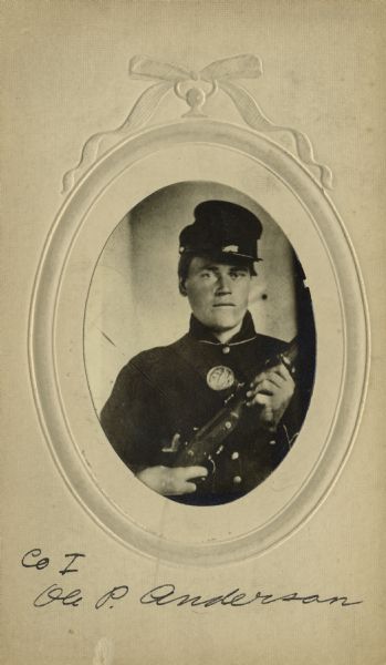 Quarter-length oval studio portrait of Ole P. Anderson, a private in Company I, Wisconsin 15 Infantry, in uniform holding a musket across his chest. The following information was obtained from the Regimental and Descriptive Rolls, Volume 20: He held residence in Scandinavia, Wisconsin. On January 02, 1861, he enlisted in La Crosse, Wisconsin and was mustered into service on January 18, 1862, in Madison, Wisconsin at the age of 19. He mustered out of service on February 10, 1865, at Chattanooga, Tennessee.