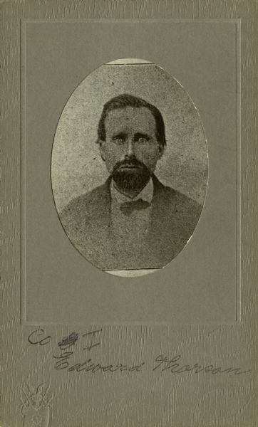 Quarter-length oval portrait of Edward Thorson [as written on the photograph backing; also written as Edward Thoreson on Descriptive Rolls, Volume 20 ("Blue Books") and published roster: Wisconsin Volunteers: War of the Rebellion (1914); also as Edward Toreson Descriptive Rolls, Volume 20 ("Red Books") and as Edward Thorsen on published roster: Rosters of Wisconsin Volunteers, Volume 1 (1886)], a private in Company I, 15th Wisconsin Infantry. The following information was obtained from the Regimental and Descriptive Rolls, Volume 20: He held residence in Pepin, Wisconsin. On December 10, 1861, he enlisted in Pepin, Wisconsin and on December 20, 1861 he was mustered into service in Madison, Wisconsin at the age of 26. He was mustered out of service on February 10, 1865, at Chattanooga, Tennessee.
