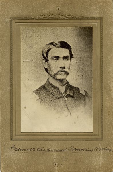 Head and shoulders studio portrait of Cornelius E. Williams, a first lieutenant in Company H, 15th Wisconsin Infantry. The following information was obtained from the Regimental and Descriptive Rolls, Volume 20: He resided in Cambridge, Wisconsin. On March 3, 1862, he enlisted and was mustered into service in Madison, Wisconsin at the age of 23. He was promoted to the rank of second lieutenant on June 10, 1862, at Island No. 10, Tennessee. In November 1862, he was detached from the company to command the Pioneer Corps until August 1864. While at Chattanooga, Tennessee in June 1863, he was further promoted to first lieutenant. From August 1864 until he was mustered out of service on February 13, 1865, he served as the assistant quarter master of the detachments at Chattanooga, Tennessee.