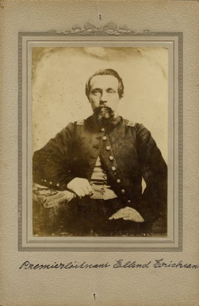 Waist-up seated studio portrait of Ellend Erickson, a first lieutenant in Company K, 15th Wisconsin Infantry, in uniform. The following information was obtained from the Regimental and Descriptive Rolls, Volume 20: He resided in Freeborn, Minnesota. On November 11, 1861 he enlisted and was mustered into service in Madison, Wisconsin at the age of 26. He was appointed to the rank of corporal on February 01, 1862. By May 1, 1862, he received another appoint this time to the rank of sergeant. In June 1863, he received a commission as a second lieutenant and was left to recover from an illness on Island No. 10, Tennessee. During the fighting that took place near New Hope Church, Georgia on May 27, 1864, he was captured and held as a prisoner of war until he was exchanged on September 29, 1864. He received his final promotion on November 10, 1864, to first lieutenant. He mustered out with the company on February 10, 1865, at Chattanooga, Tennessee.
